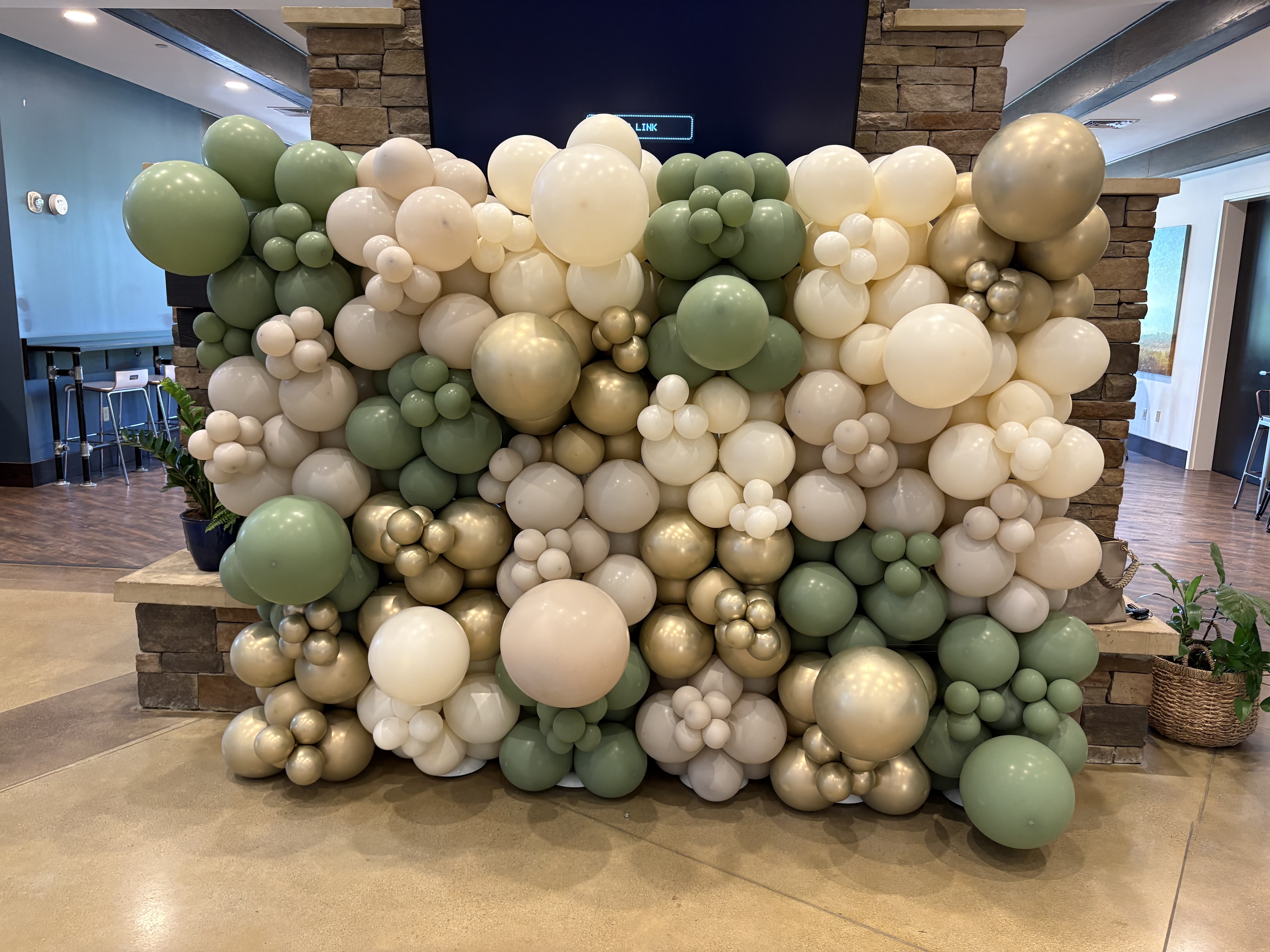 Sage green balloon wall